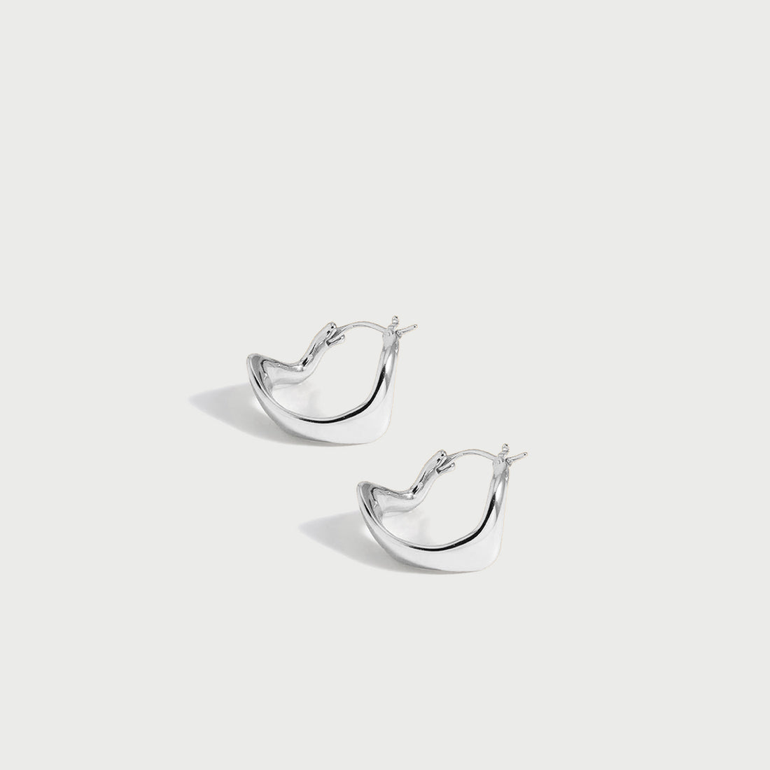 Curved Mini Hoop Earrings in Silver