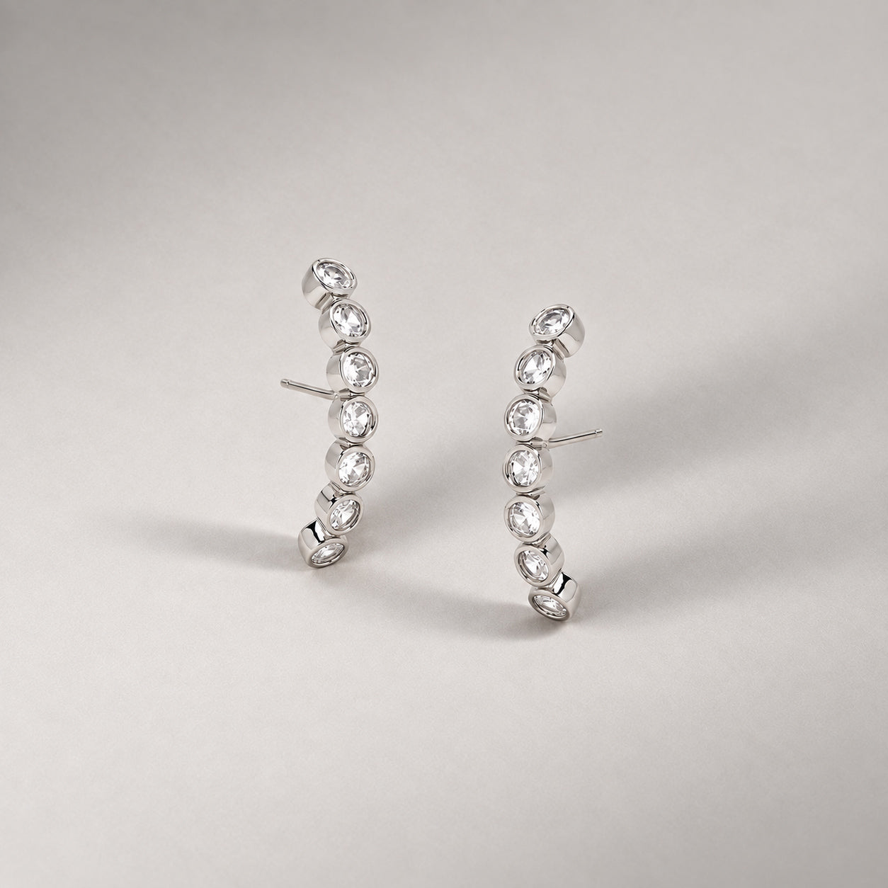 Averto Face On Stud Earrings in Silver and Crystals