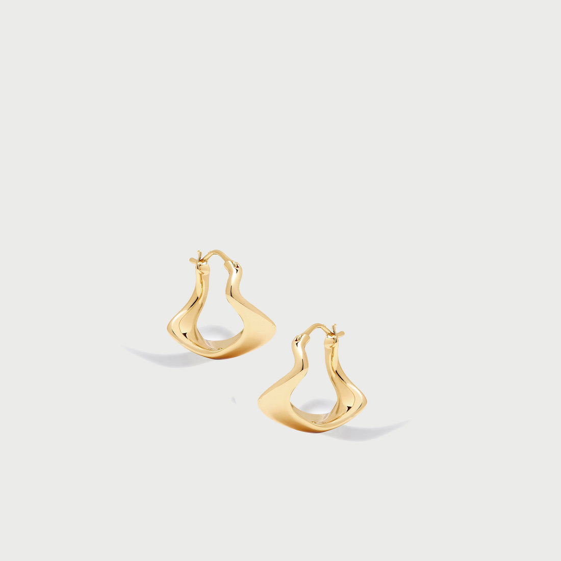 Curved Mini Hoop Earrings in Gold