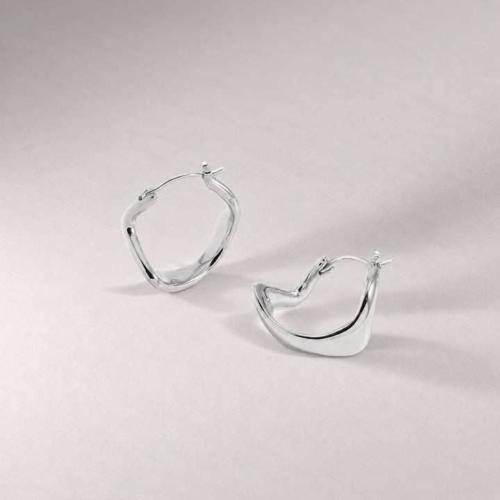 Curved Mini Hoop Earrings in Silver