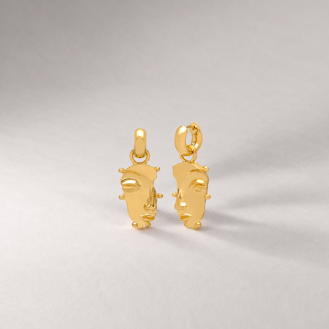 Visage Drop Hoop Earrings in Gold