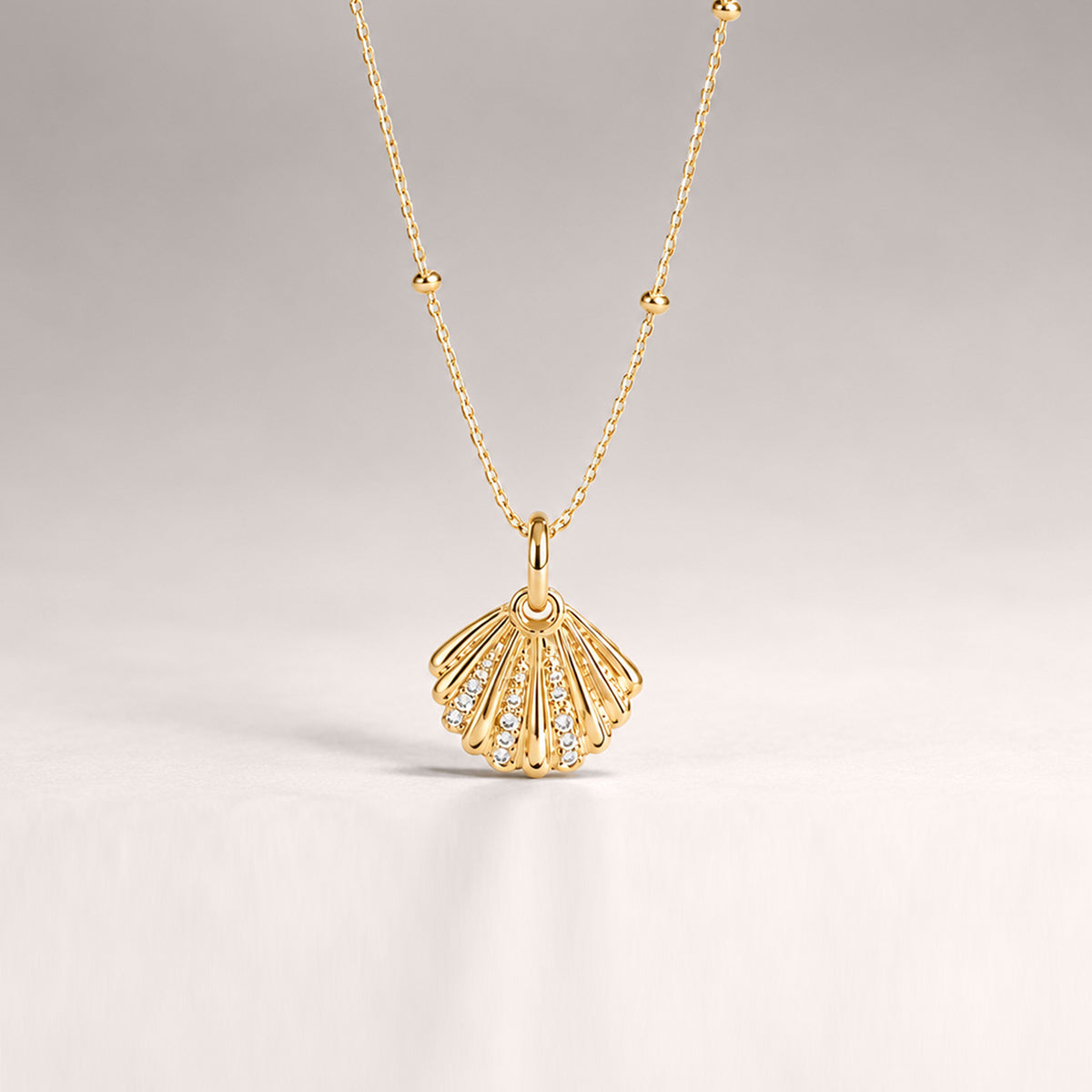 QUERO CRYSTAL PENDANT NECKLACE IN GOLD