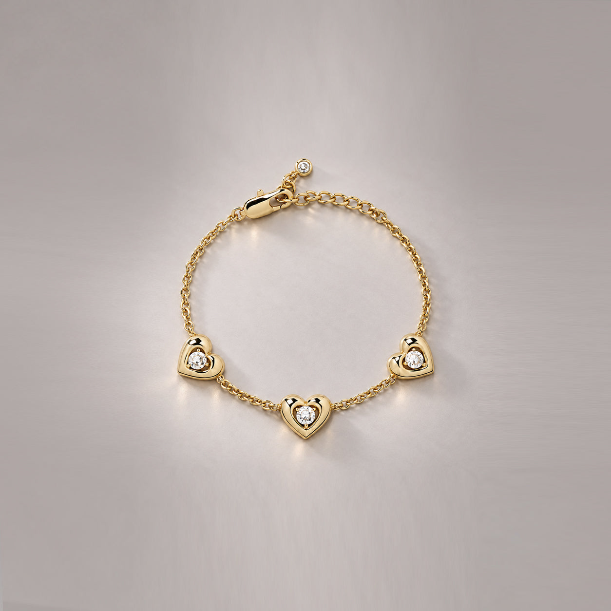 AFELLO HEART CRYSTAL STATION BRACELET IN GOLD & CRYSTAL