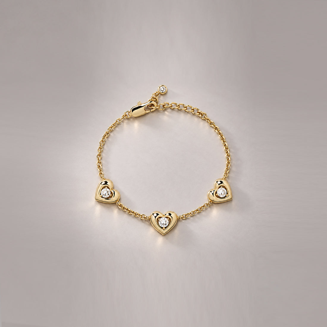 AFELLO HEART CRYSTAL STATION BRACELET IN GOLD & CRYSTAL