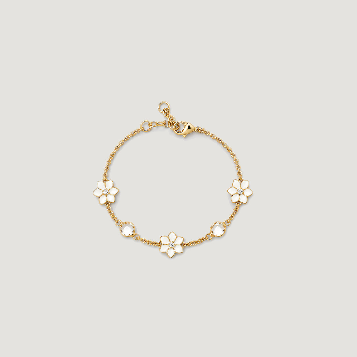 XANTIA FLOWER STONE STATION BRACELET IN GOLD & MOONSTONE WITH WHTE ENAMEL