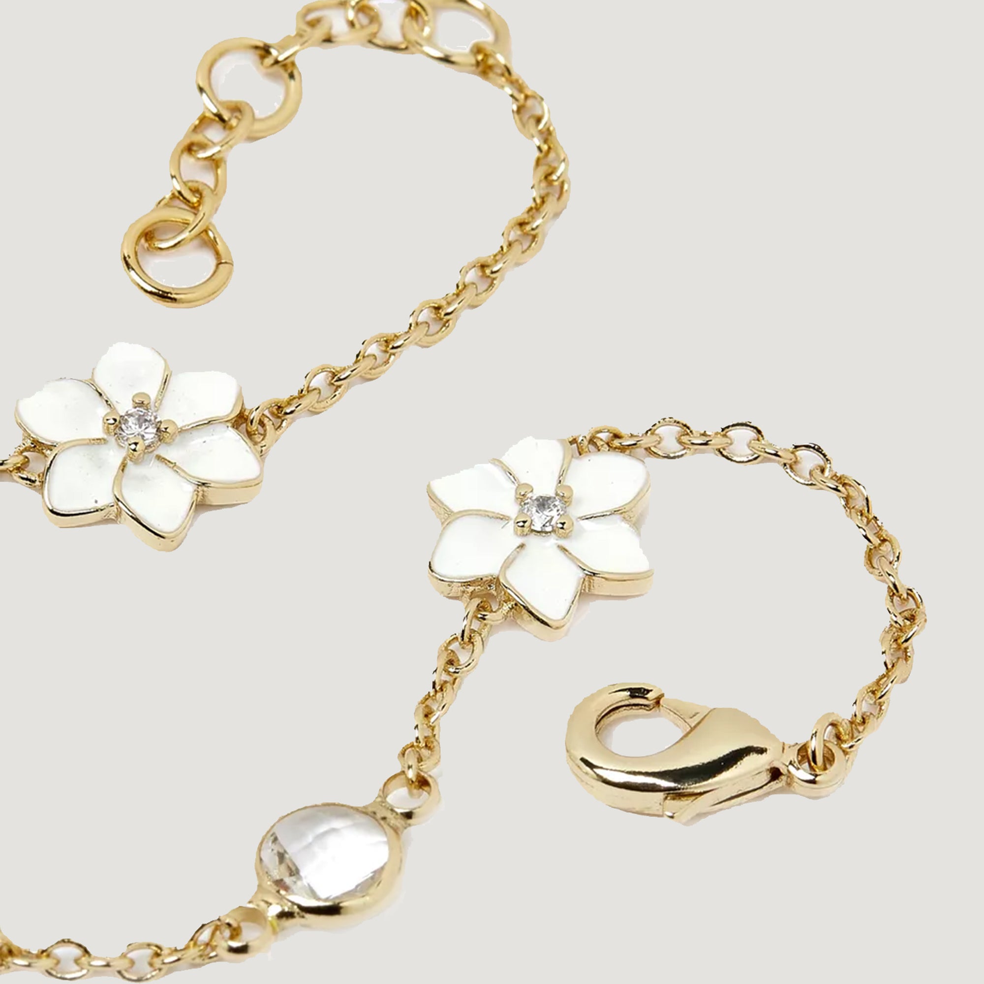 XANTIA FLOWER STONE STATION BRACELET IN GOLD & MOONSTONE WITH WHTE ENAMEL