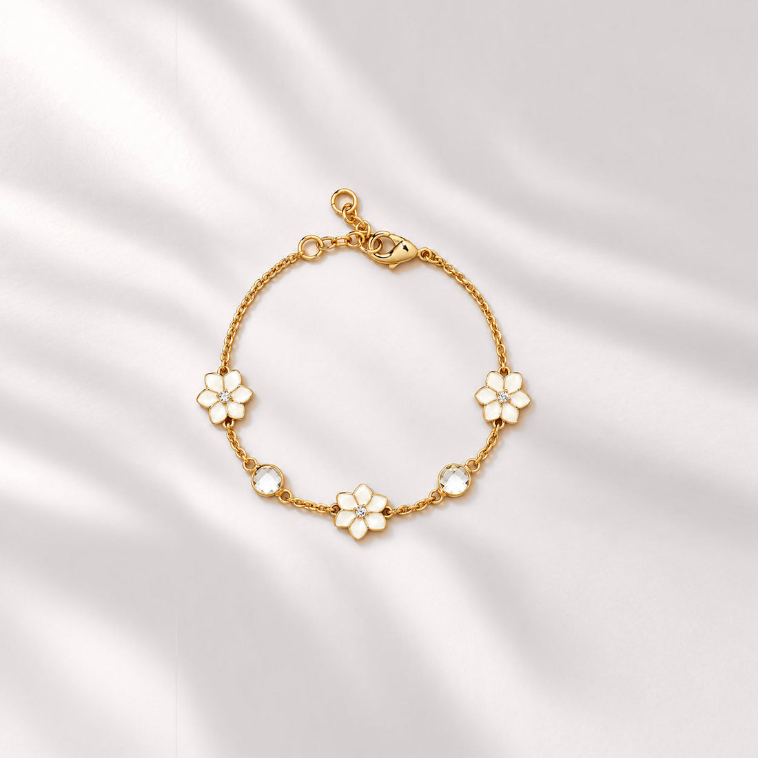 XANTIA FLOWER STONE STATION BRACELET IN GOLD & MOONSTONE WITH WHTE ENAMEL
