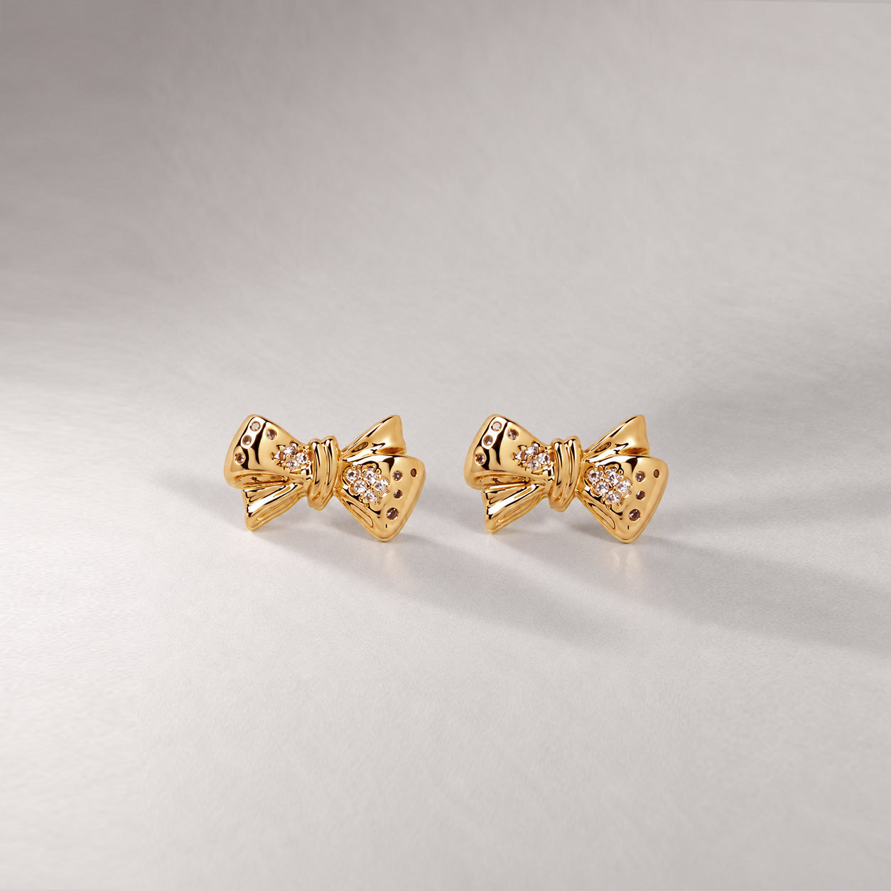 BOW MAXI STUD EARRINGS IN GOLD & CRYSTAL