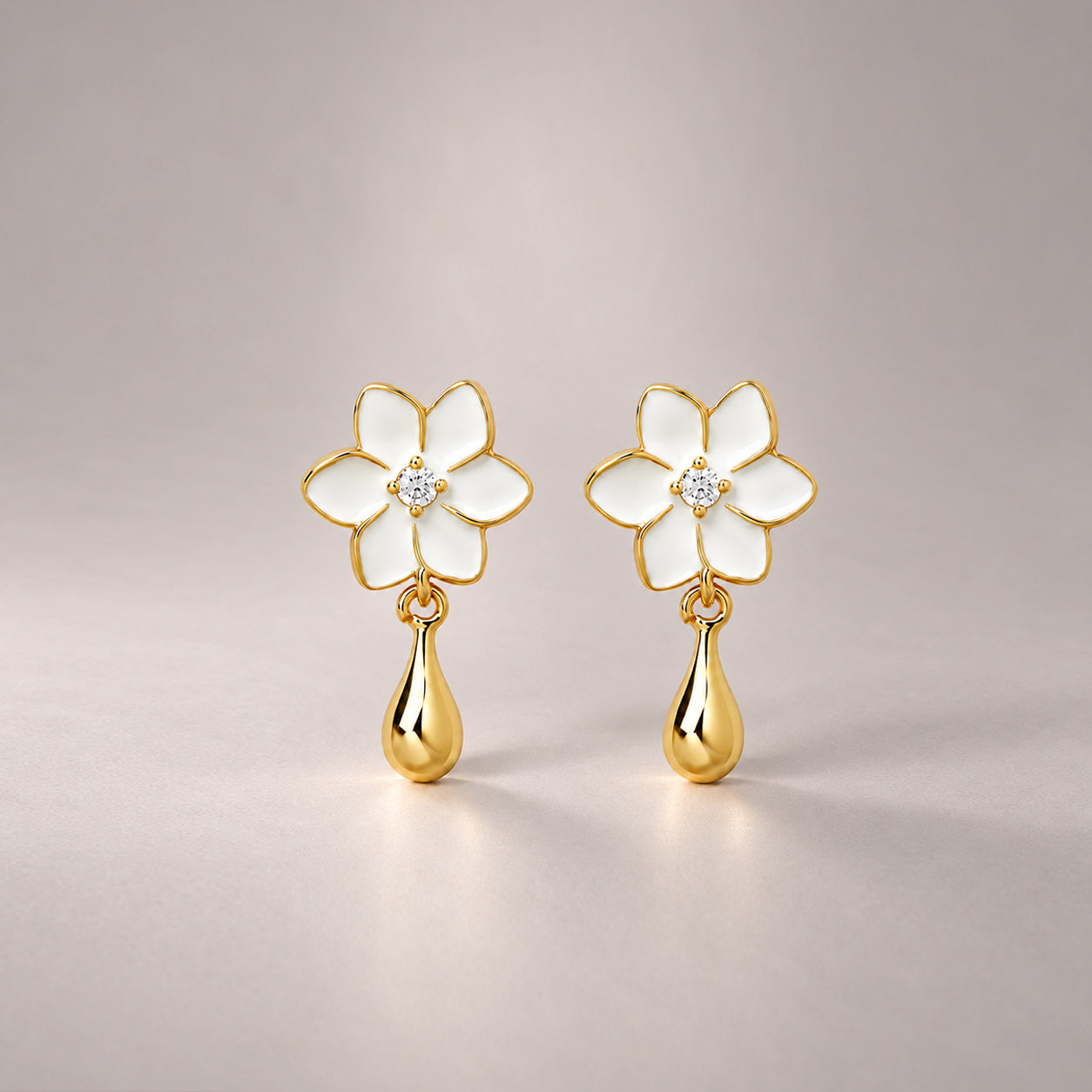 XANTIA FLOWER DROP EARRINGS IN GOLD & MOONSTONE WITH WHTE ENAMEL