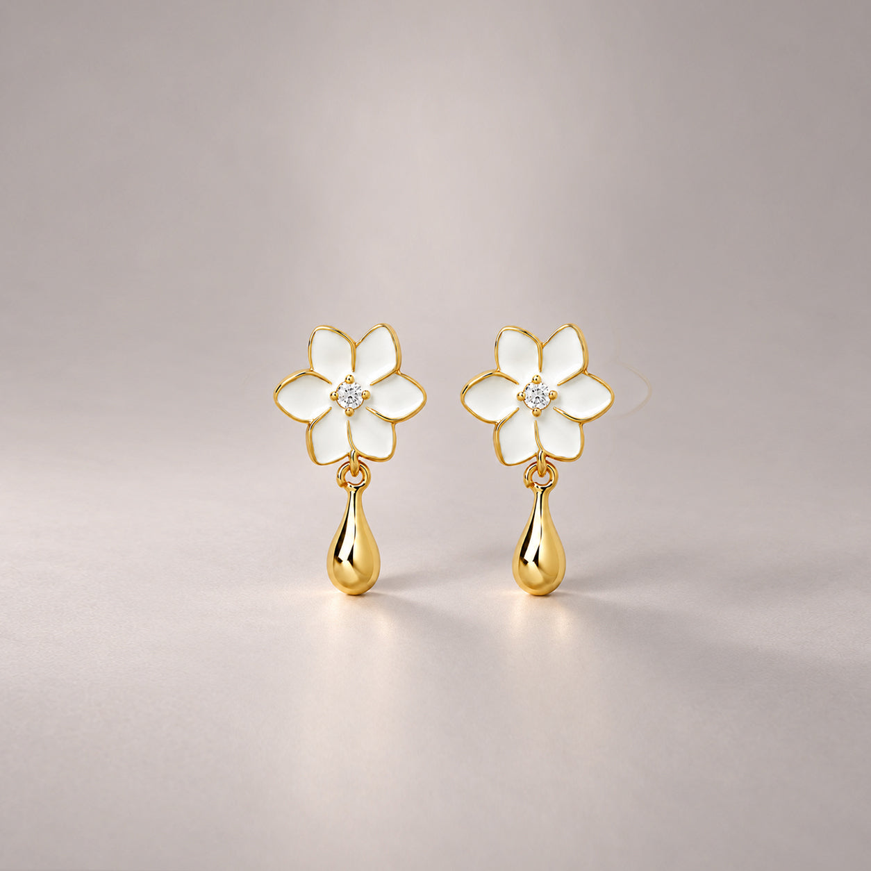 XANTIA FLOWER DROP EARRINGS IN GOLD & MOONSTONE WITH WHTE ENAMEL