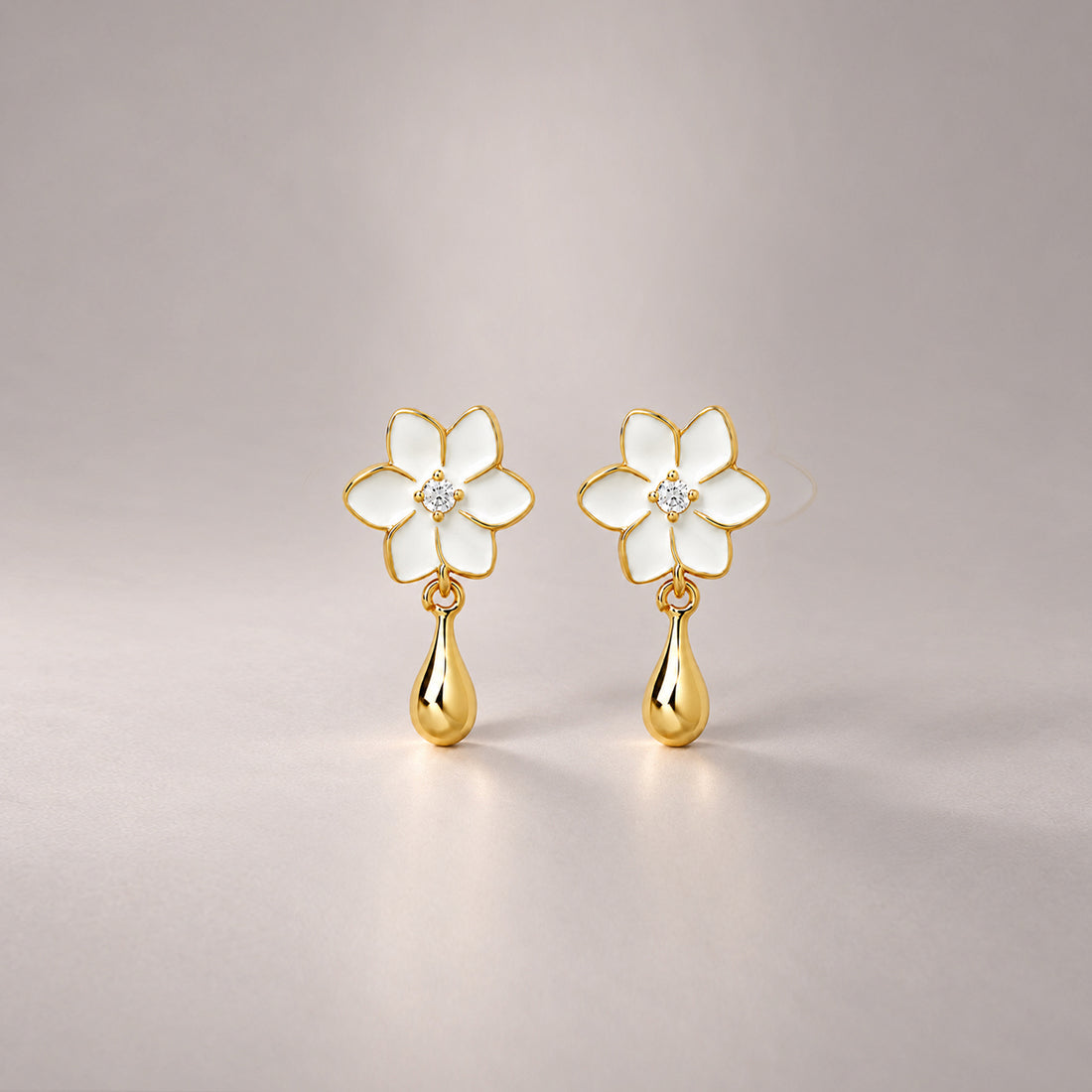 XANTIA FLOWER DROP EARRINGS IN GOLD & MOONSTONE WITH WHTE ENAMEL