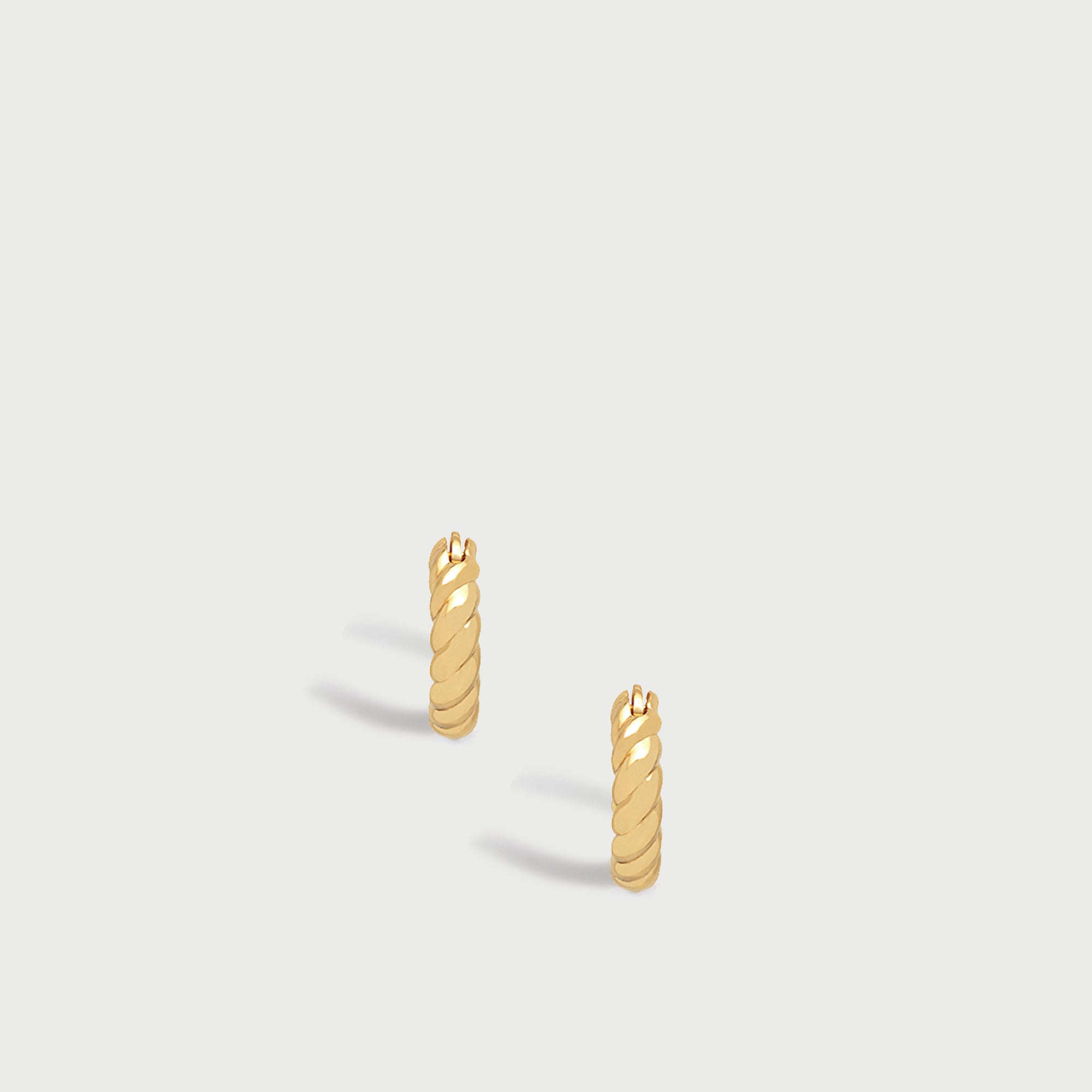 Fenny Twisted Mini Hoop Earrings in Gold