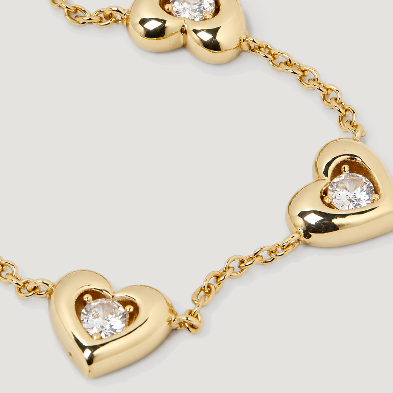 AFELLO HEART CRYSTAL STATION BRACELET IN GOLD & CRYSTAL