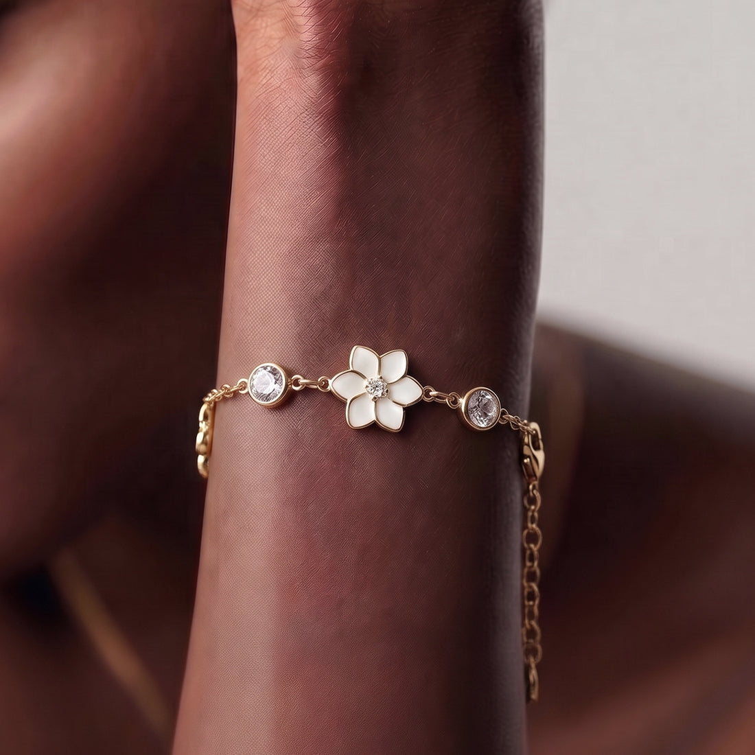 XANTIA FLOWER STONE STATION BRACELET IN GOLD & MOONSTONE WITH WHTE ENAMEL