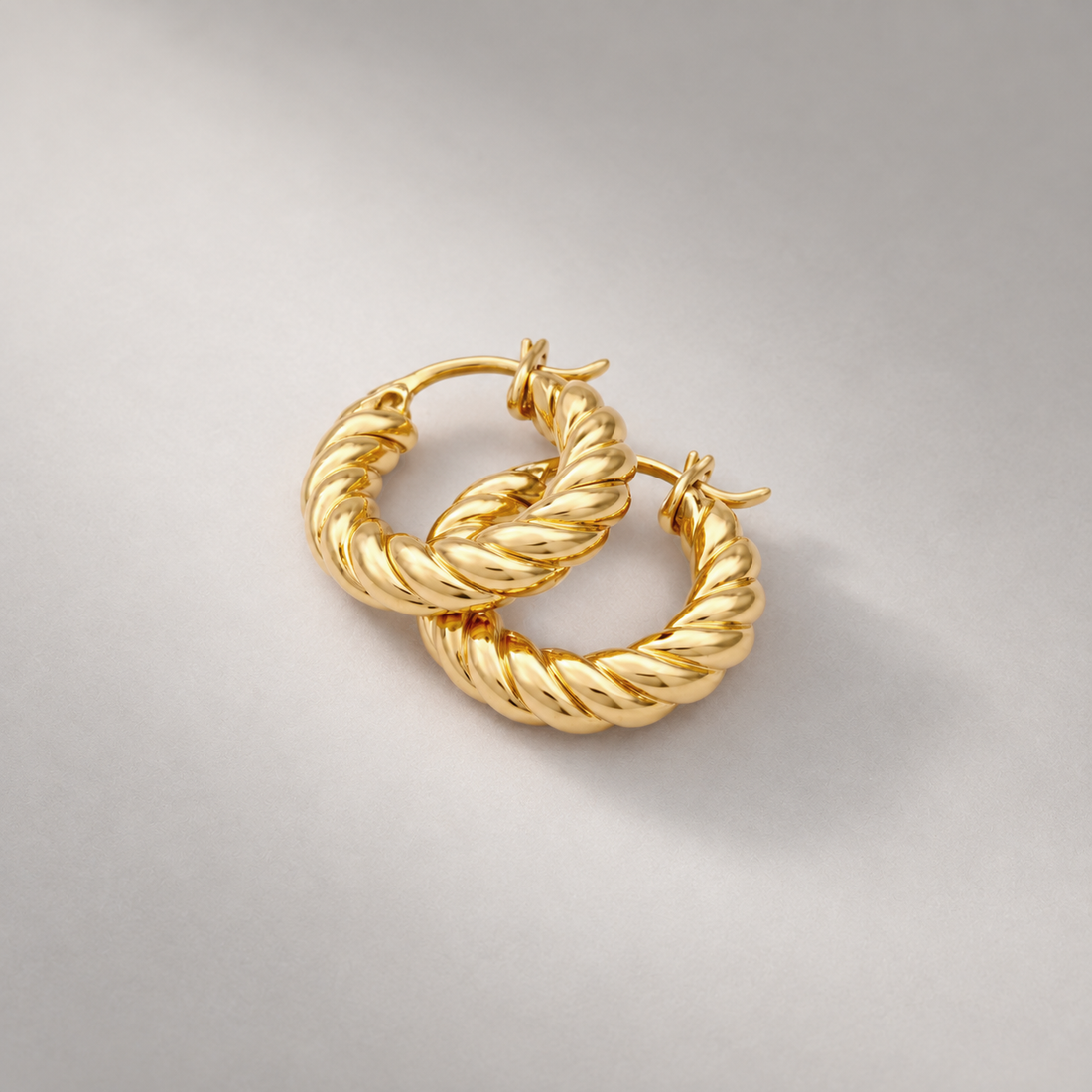 Fenny Twisted Mini Hoop Earrings in Gold