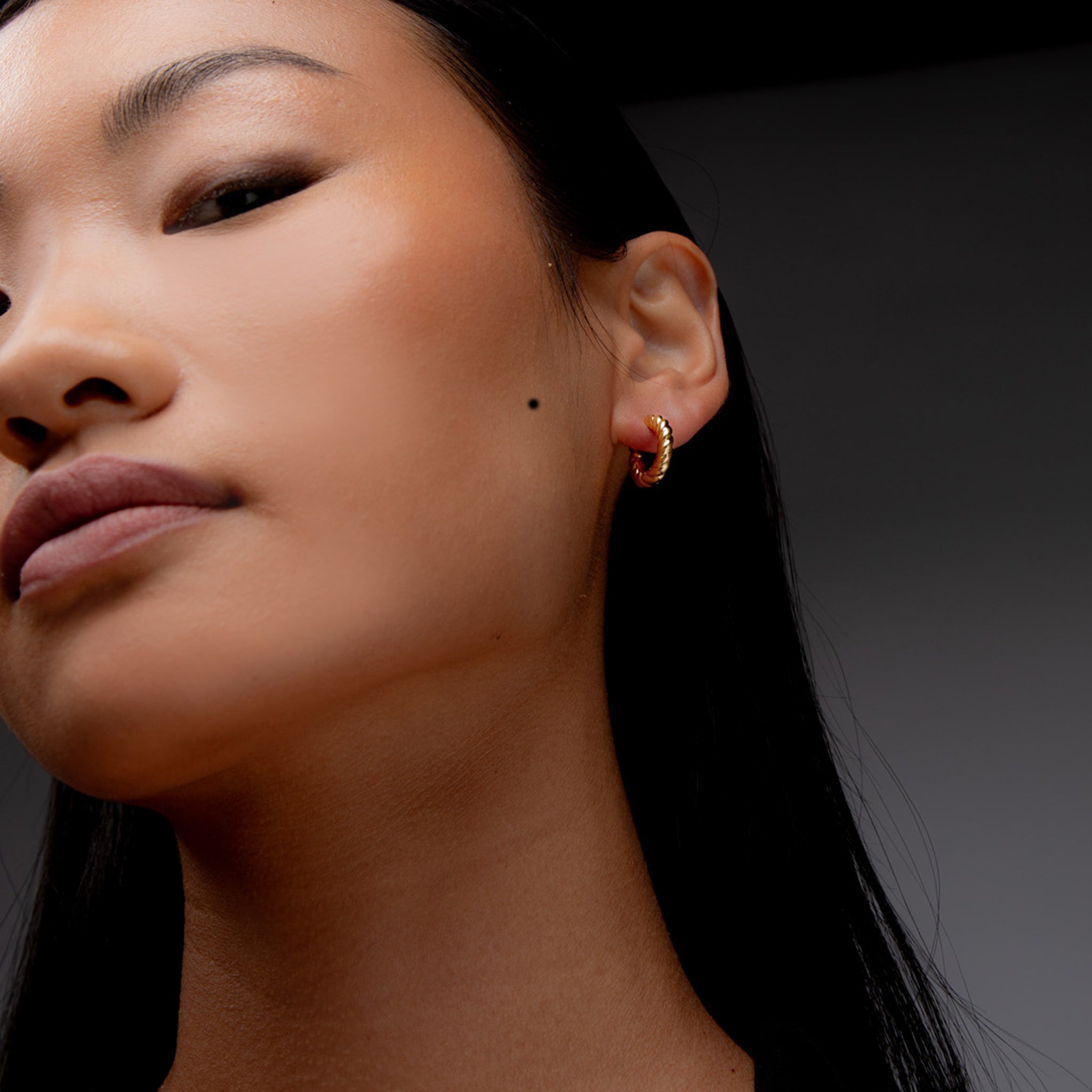 Fenny Twisted Mini Hoop Earrings in Gold