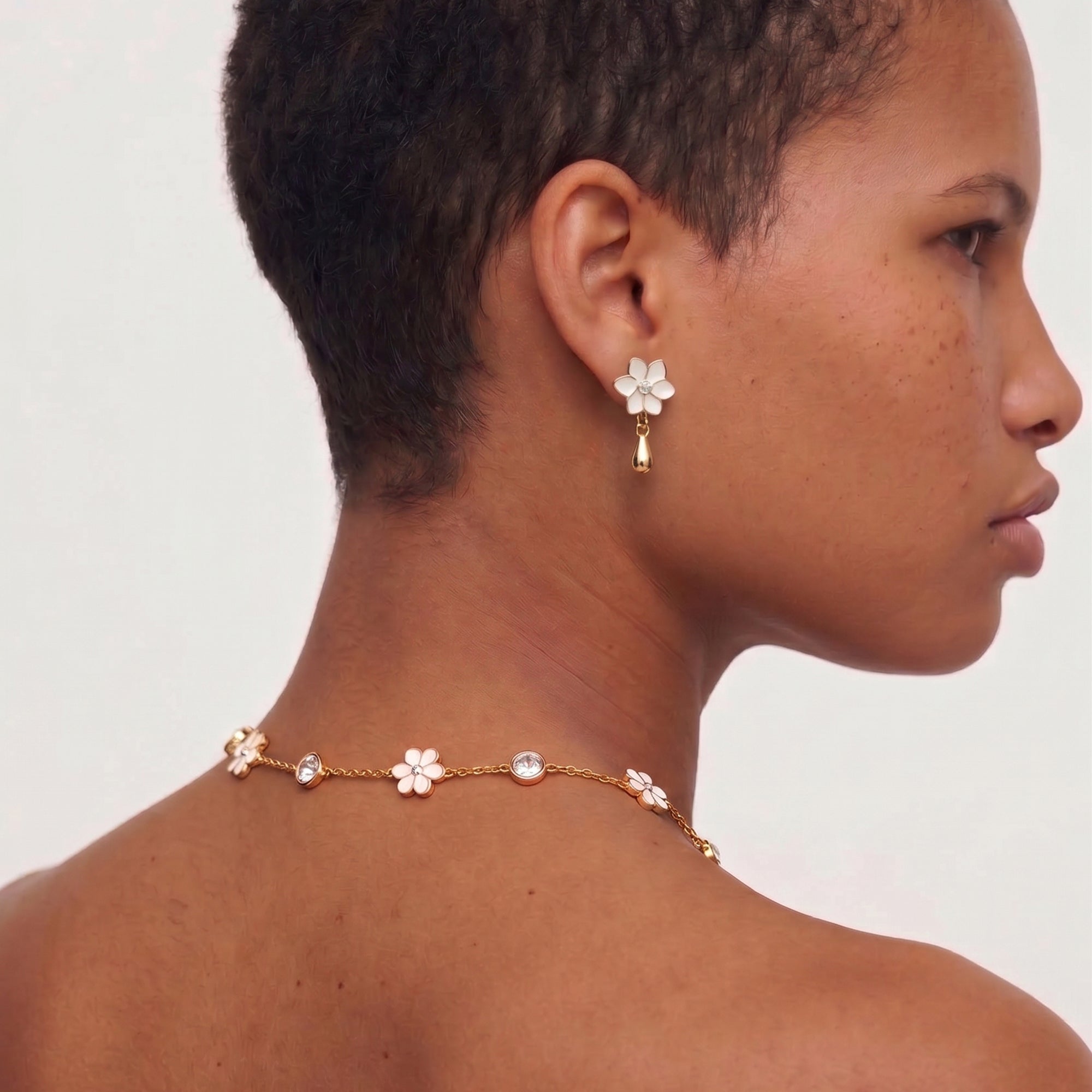 XANTIA FLOWER DROP EARRINGS IN GOLD & MOONSTONE WITH WHTE ENAMEL