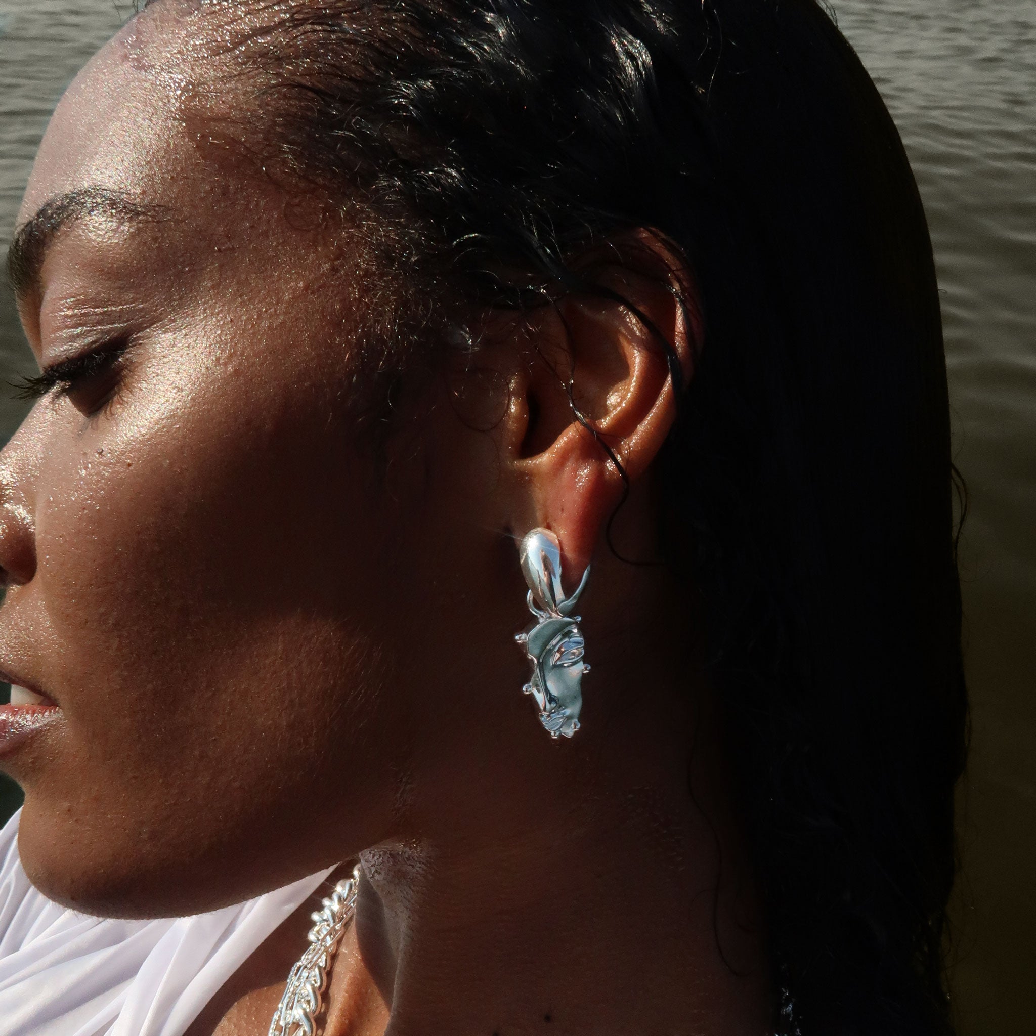 Visage Drop Hoop Earrings in Silver