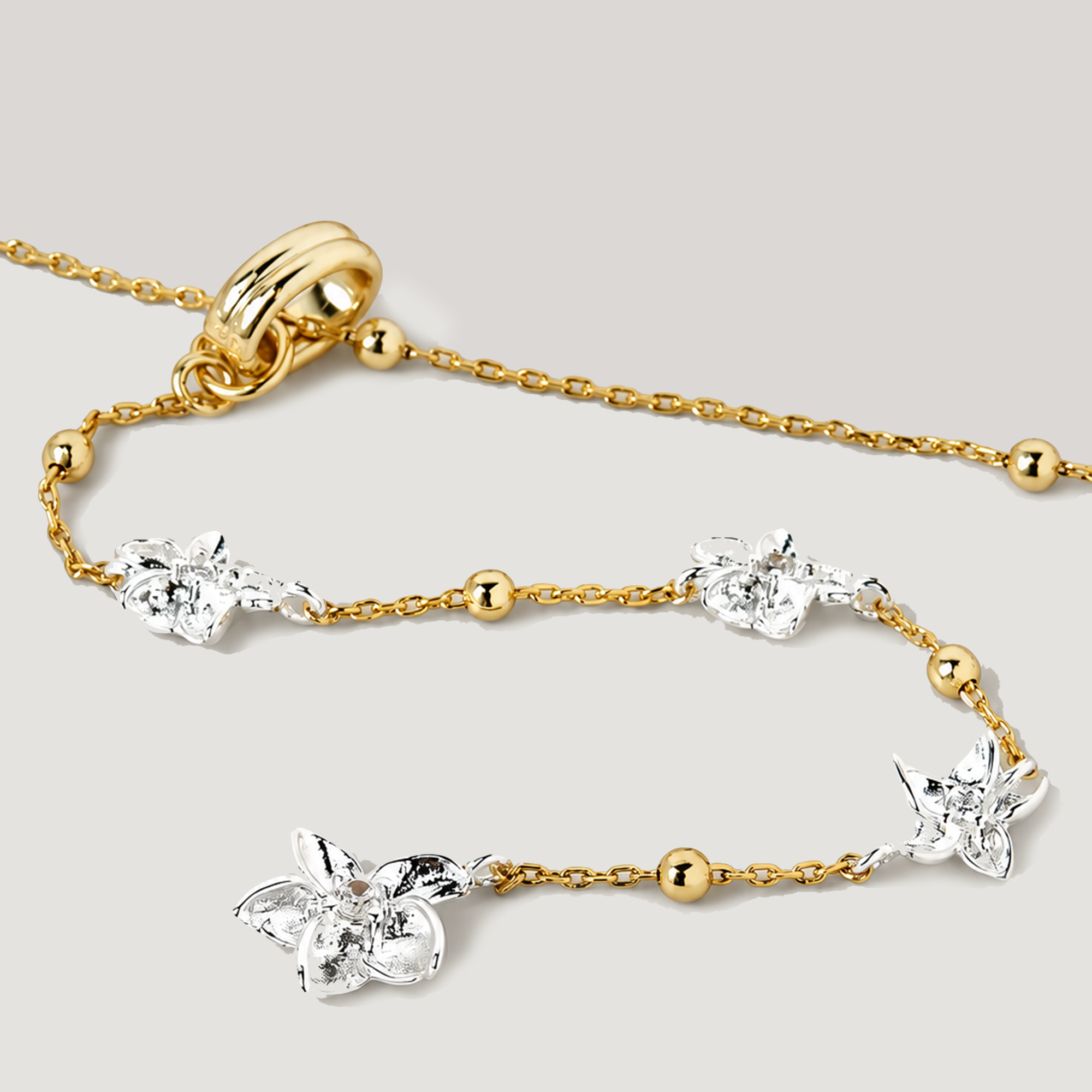 Floral Lariat Necklace In Gold Two Tone