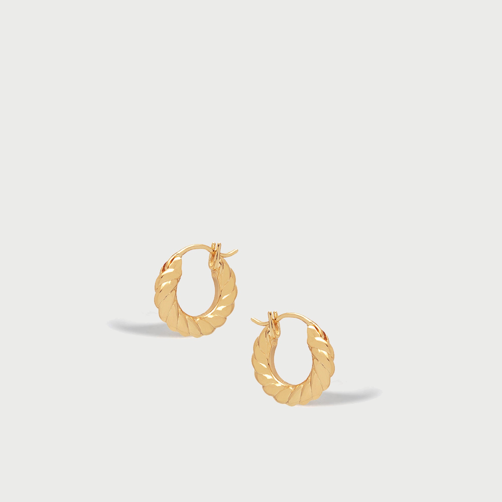 Fenny Twisted Mini Hoop Earrings in Gold