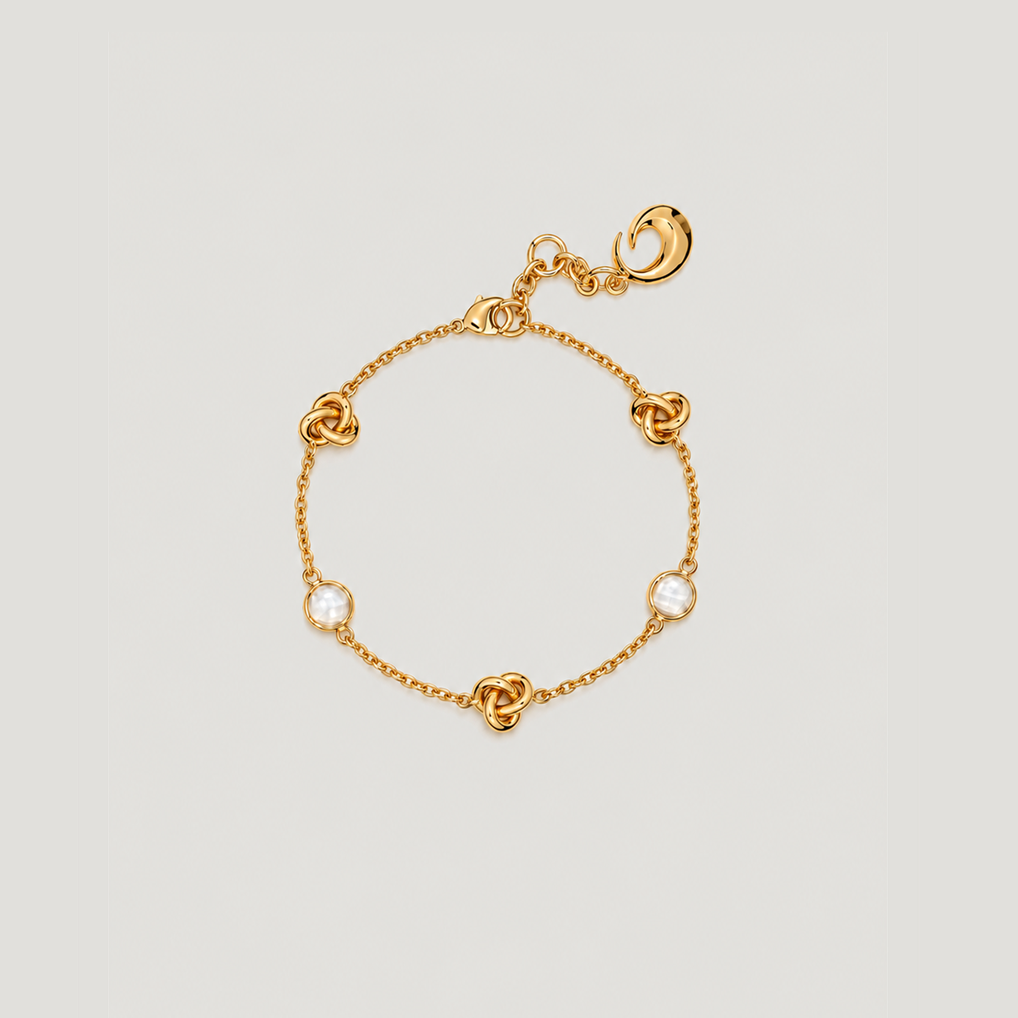 KNOT BRACELET IN GOLD AND CRYSTALS