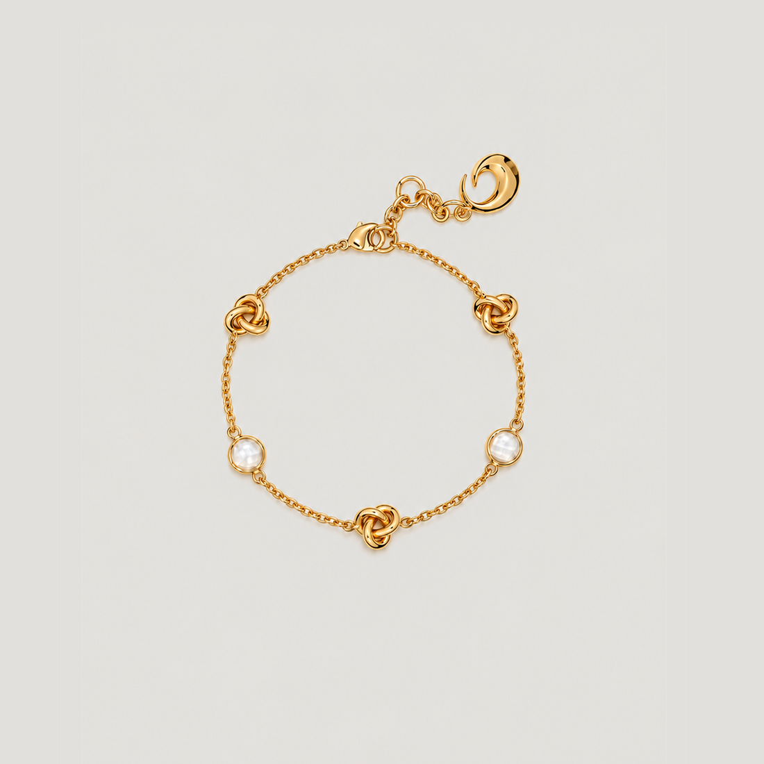 KNOT BRACELET IN GOLD AND CRYSTALS