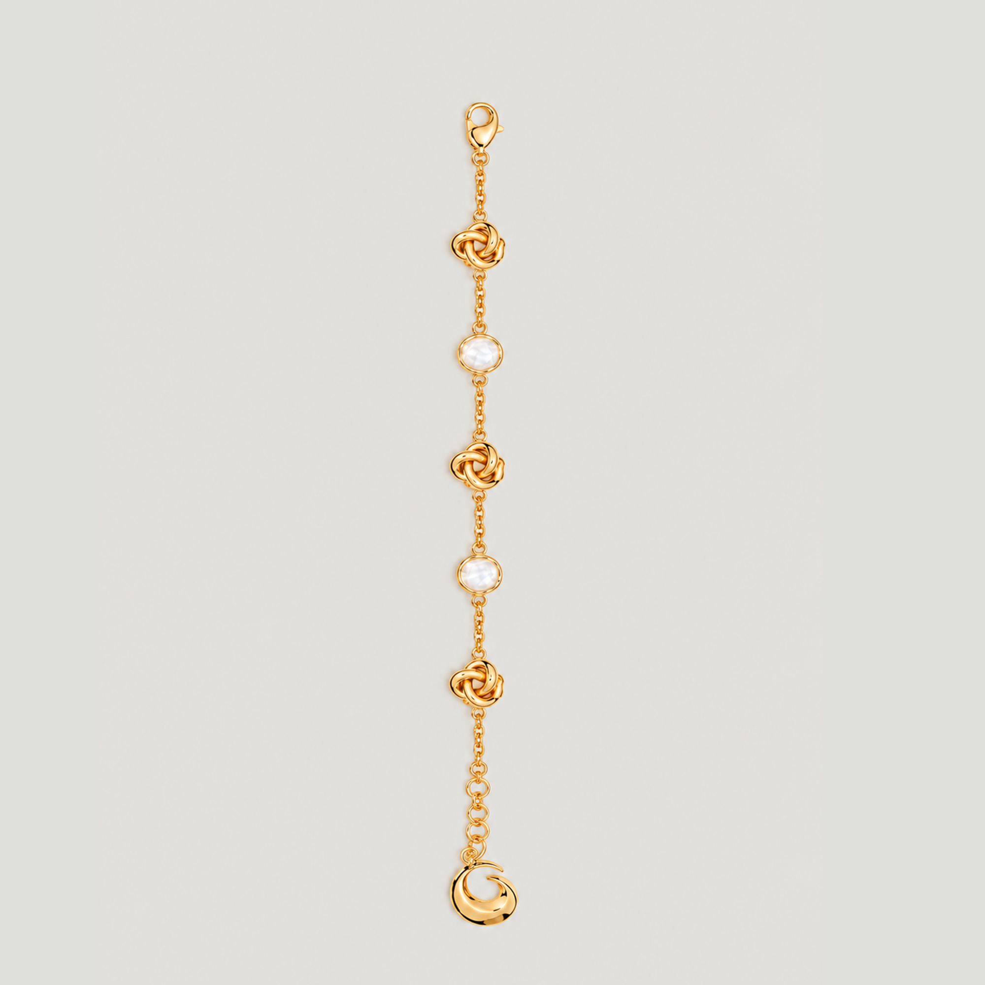 KNOT BRACELET IN GOLD AND CRYSTALS