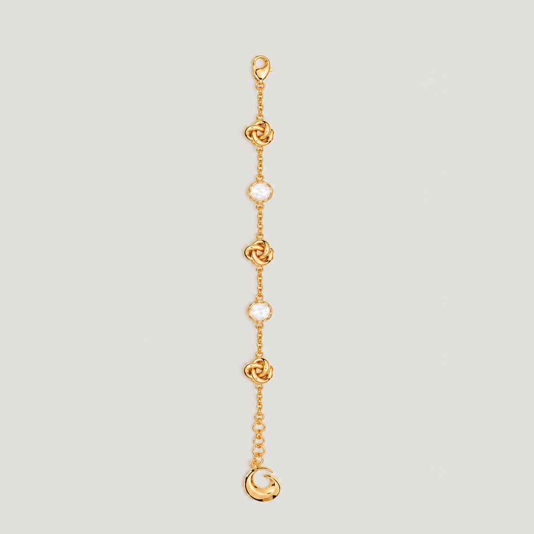KNOT BRACELET IN GOLD AND CRYSTALS