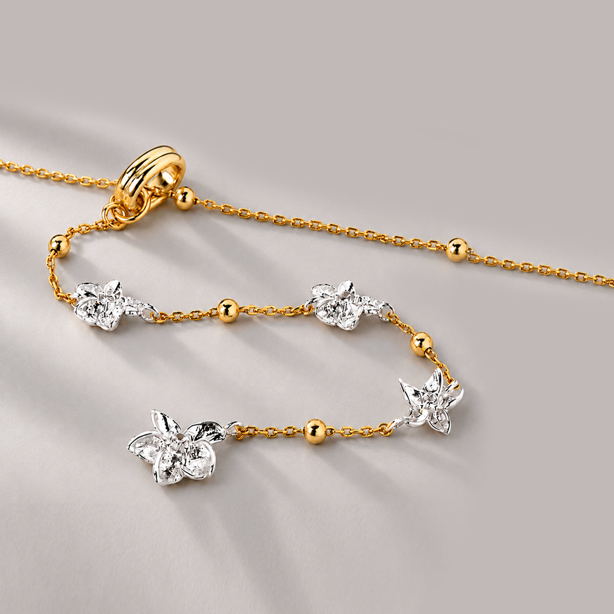 Floral Lariat Necklace In Gold Two Tone