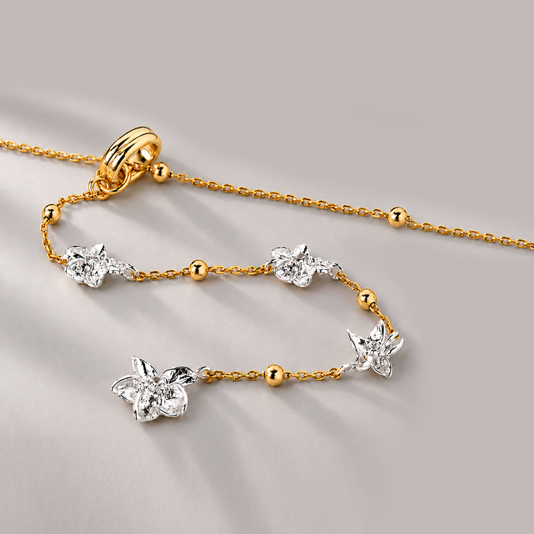 Floral Lariat Necklace In Gold Two Tone