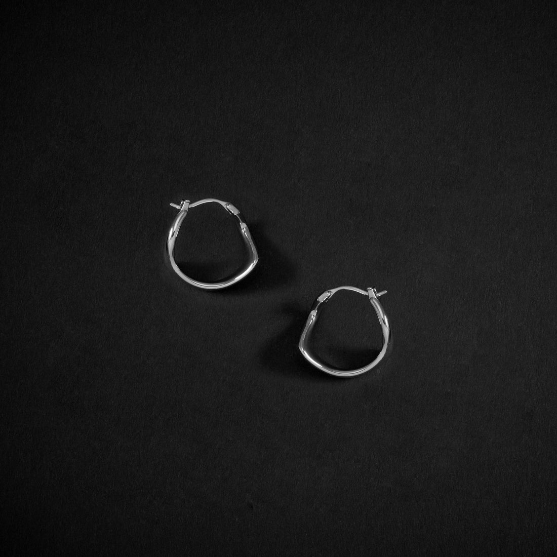 Curved Mini Hoop Earrings in Silver