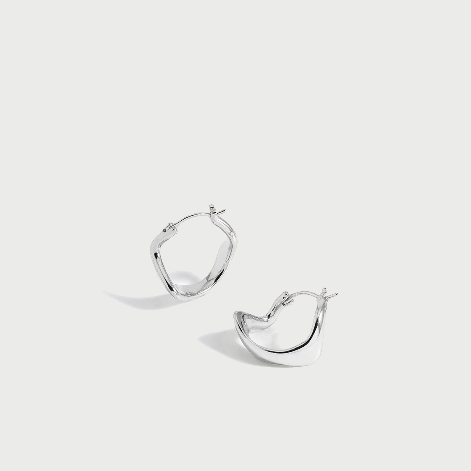 Curved Mini Hoop Earrings in Silver