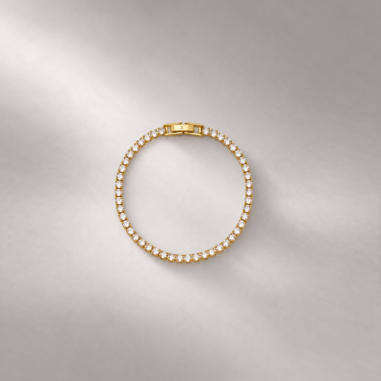TENNIS BRACELET IN GOLD AND WHITE CRYSTALS
