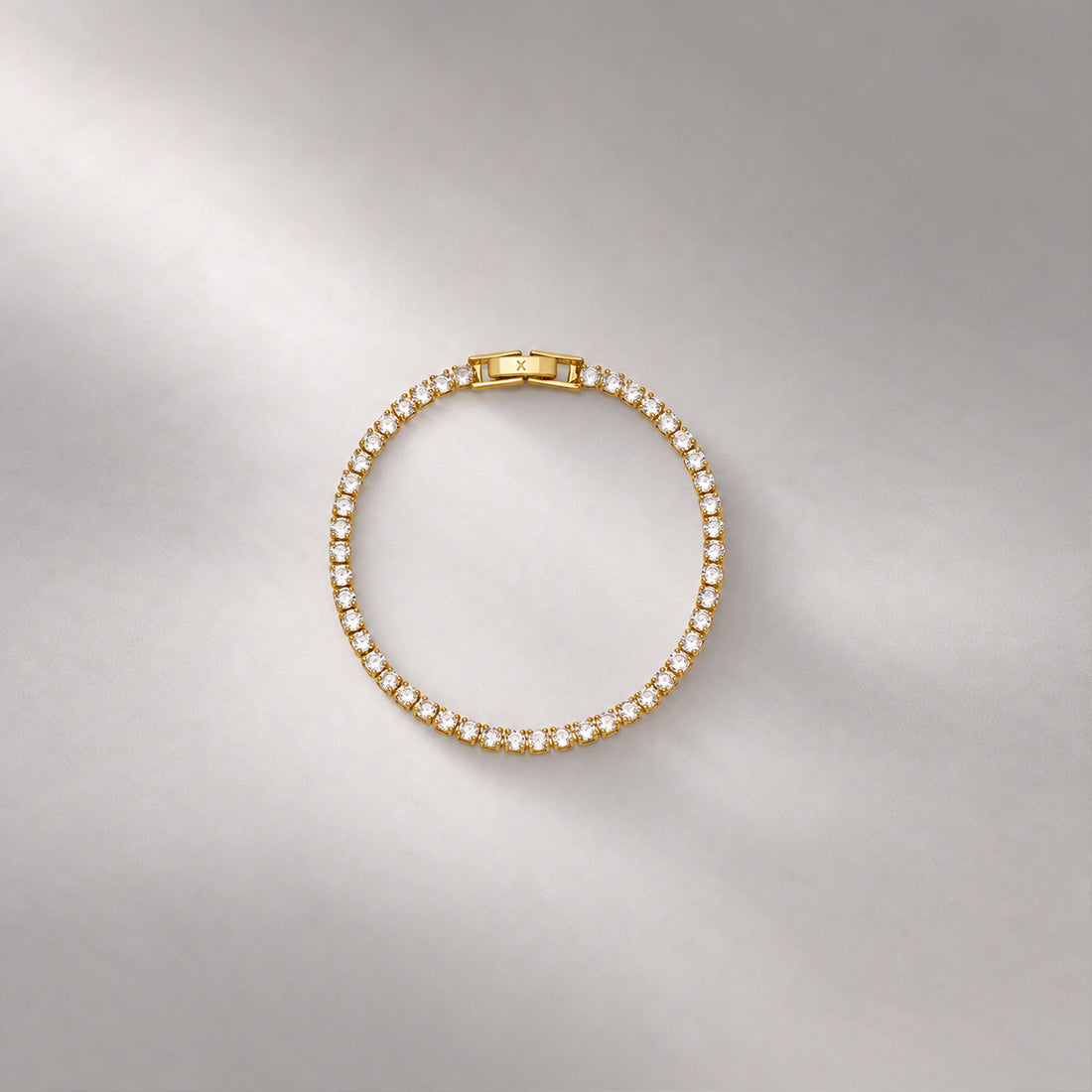 TENNIS BRACELET IN GOLD AND WHITE CRYSTALS